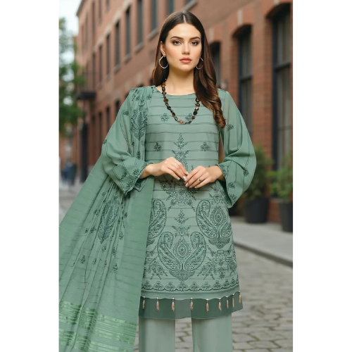 Woman wearing a green embroidered outfit on a street background