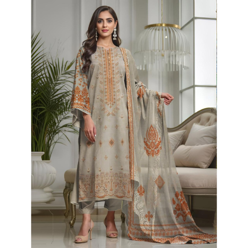Woman wearing a traditional outfit with intricate patterns in a elegant room.