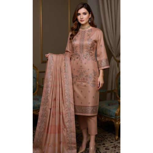 Woman wearing a peach embroidered outfit with a matching dupatta in an elegant room.