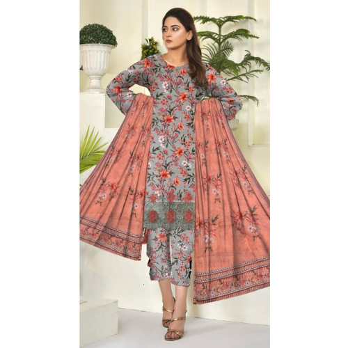 Woman wearing a floral dress with a pink dupatta in an indoor setting.