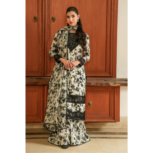 Woman wearing a floral and lace dress standing in front of wooden doors.