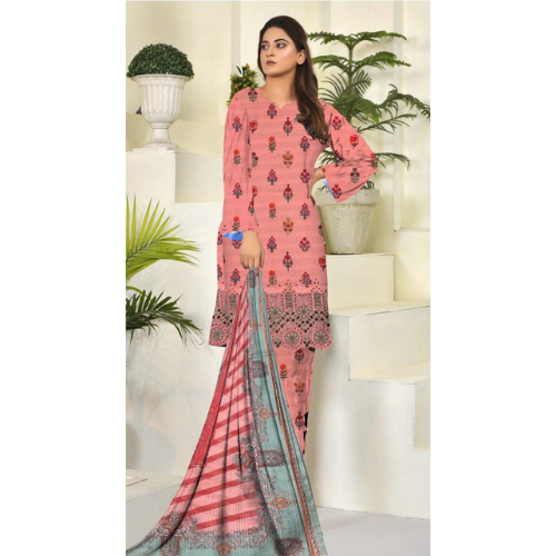 Woman wearing a pink embroidered outfit with a green dupatta in a decorated room.