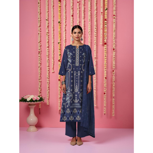 Woman wearing a blue embroidered outfit against a pink background with decorative elements.