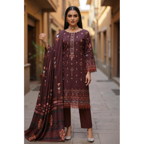 Woman in a traditional maroon outfit with intricate patterns walking down a street.