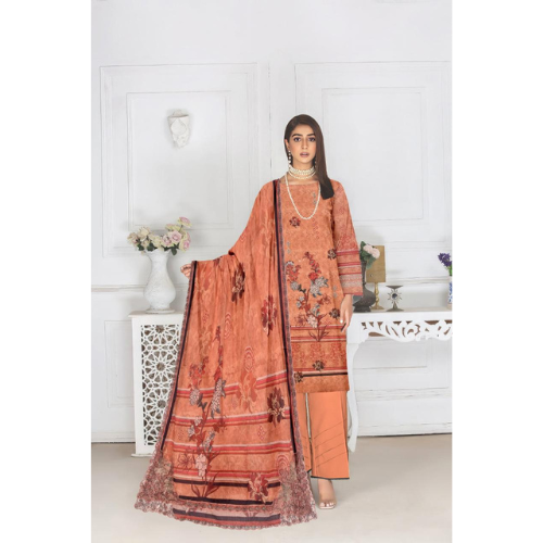 Woman wearing an orange traditional outfit with a matching dupatta in a white room.