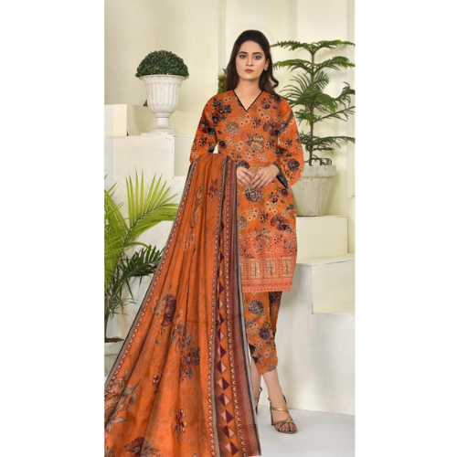 Woman wearing an orange traditional outfit with a patterned dupatta in a well-lit room.