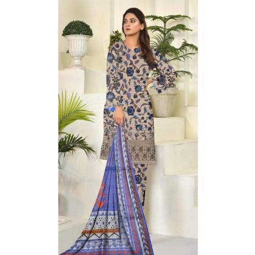 Woman wearing a floral dress with a blue dupatta in a decorated indoor setting
