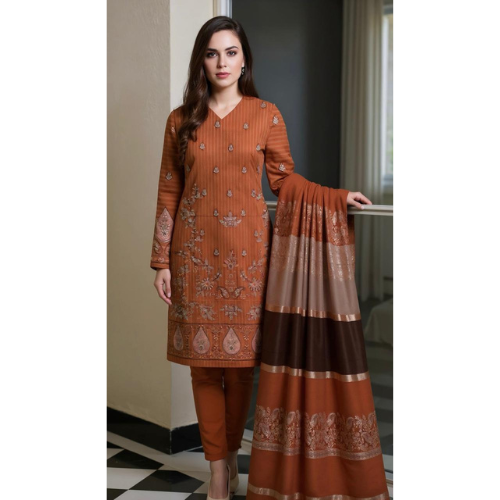 Woman wearing a brown traditional outfit with intricate patterns in a room.