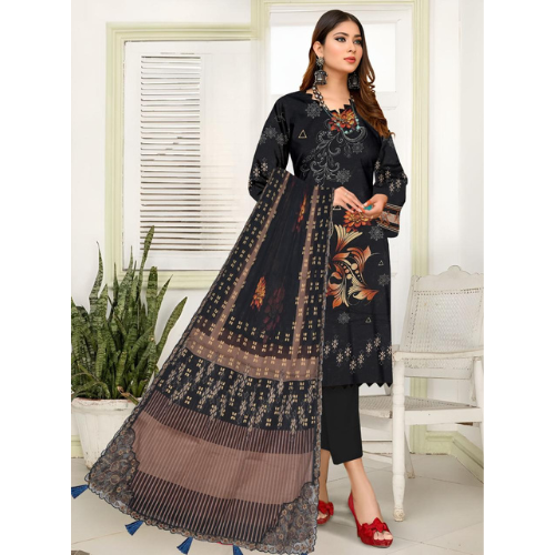 Woman wearing a black and brown traditional outfit with a floral pattern in a room.